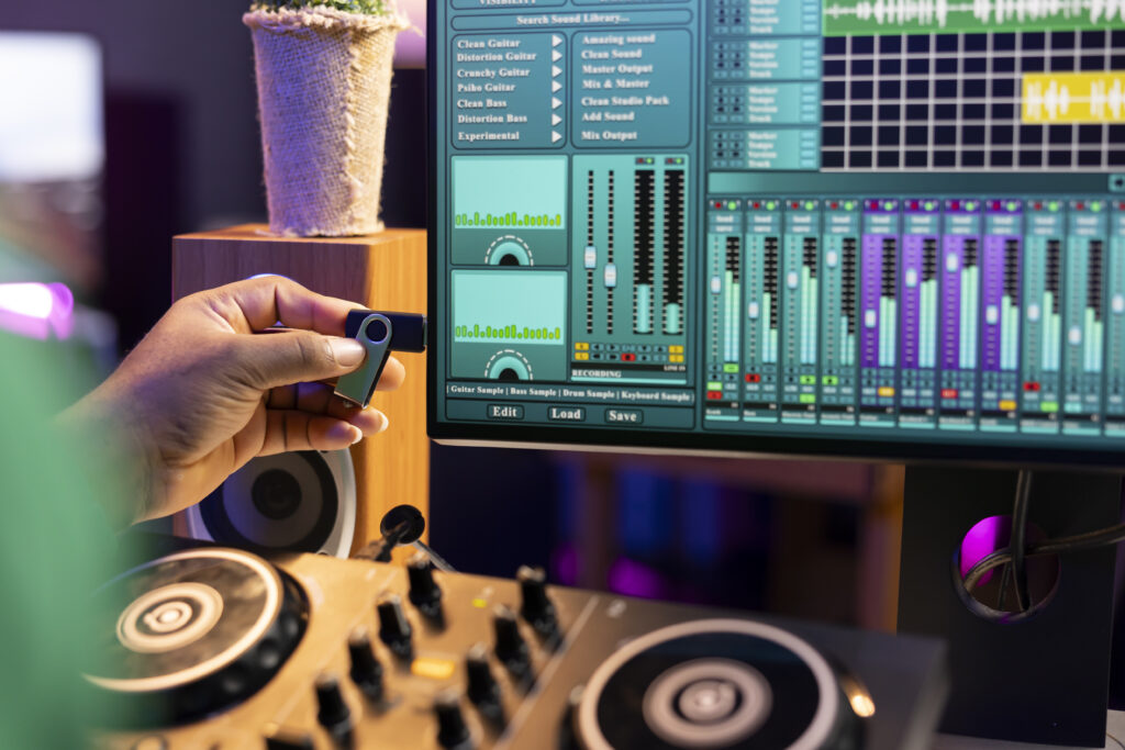 Musical producer using usb stick to edit old audio files on production software